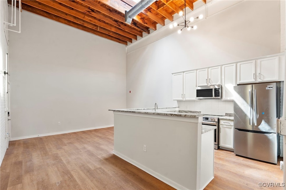 Kitchen with stainless steel appliances, a high ce