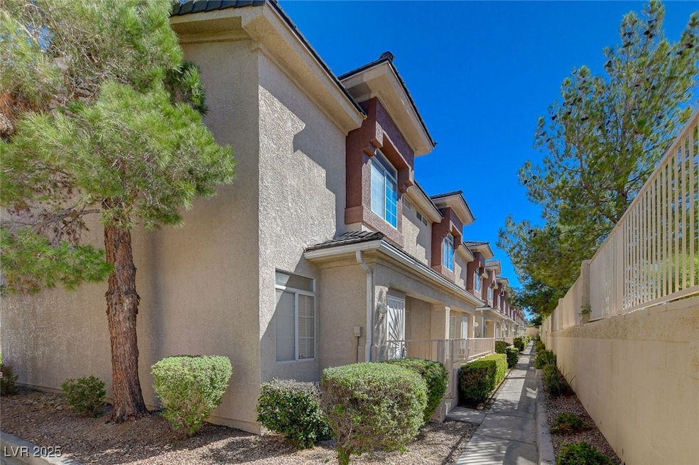 View of side of property featuring stucco siding