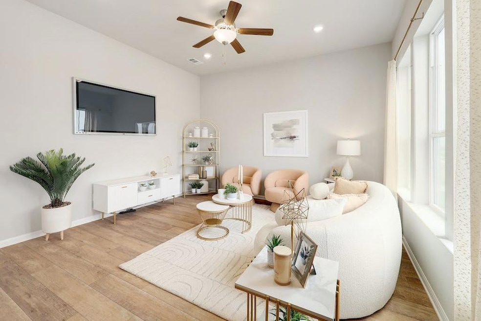 Living area featuring light wood-style floors, a 