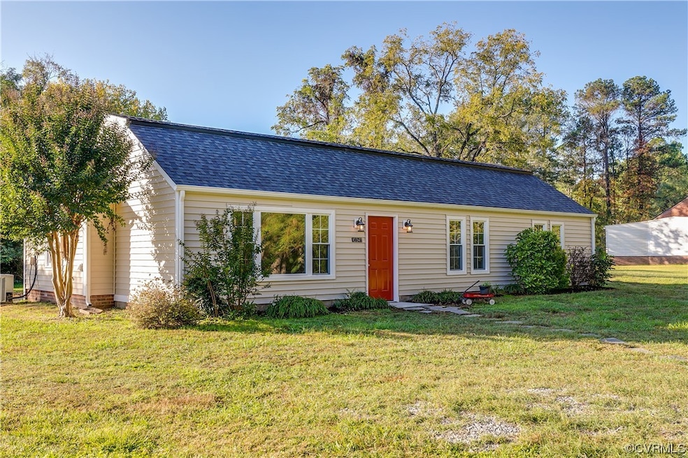 View of front of property with a front yard