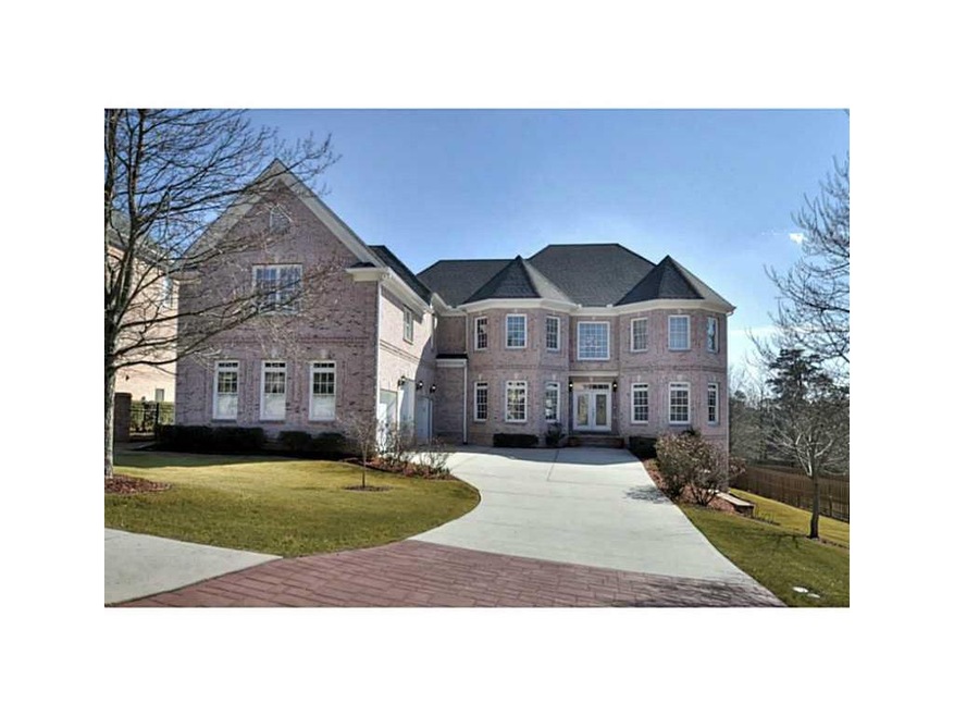 Exterior Front. All brick executive type home. 3 c