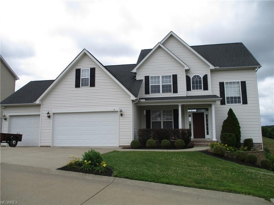 Front view with 3 car attached garage
