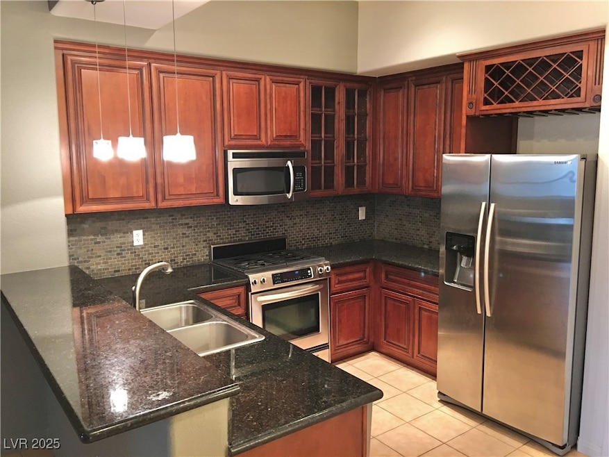 Kitchen featuring stainless steel appliances, a pe