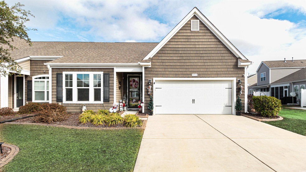 View of front of property featuring a garage and a