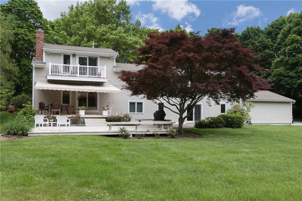 Back yard view of patio and deck