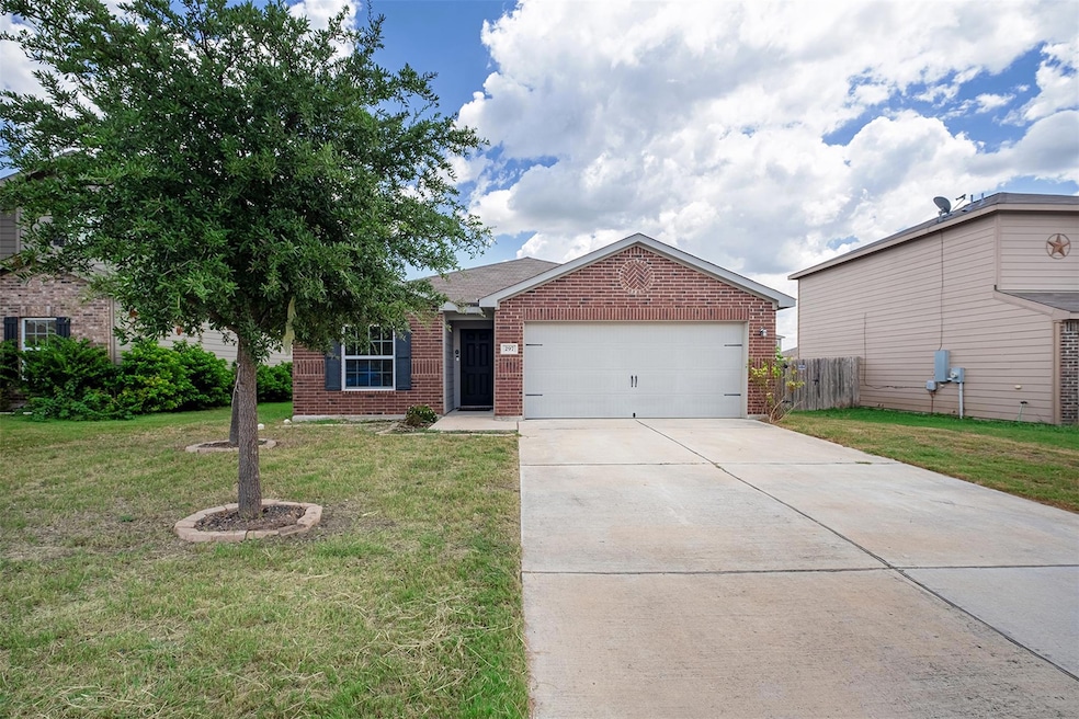 Single story home featuring brick siding, an atta