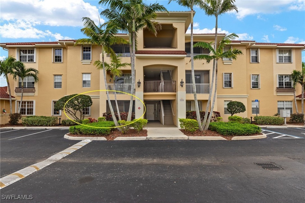 View of property with uncovered parking