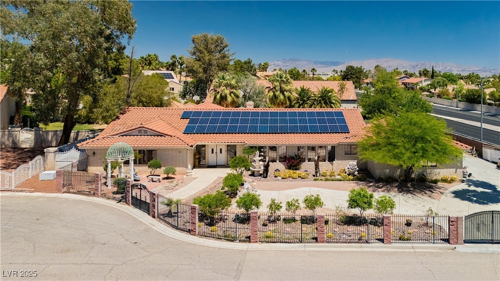 Mediterranean / spanish-style house with a fenced