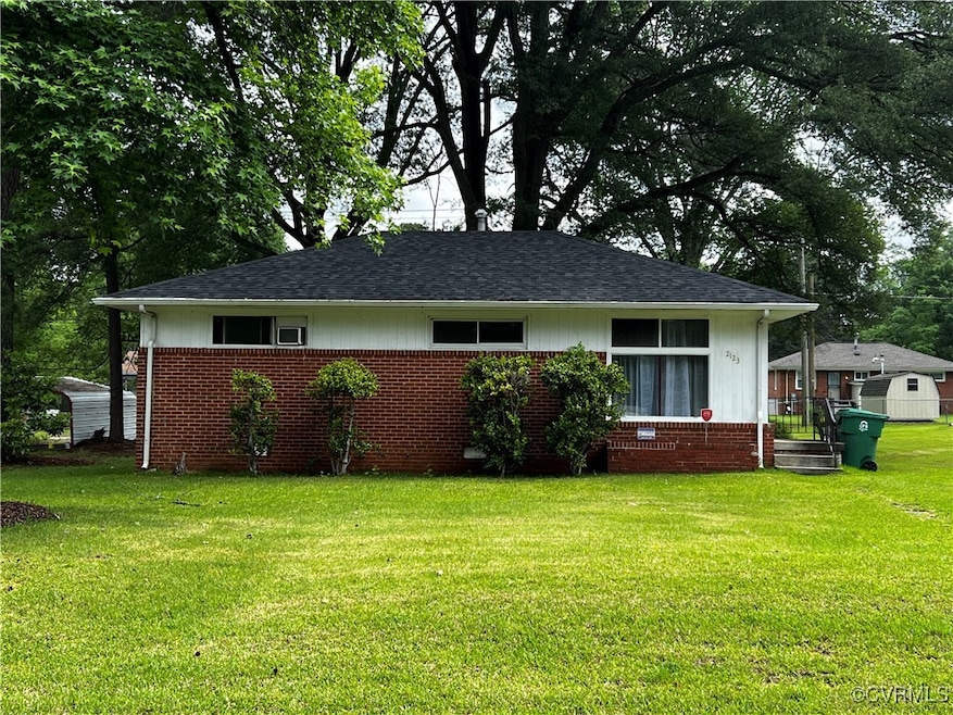 View of front of home featuring brick siding, a fr