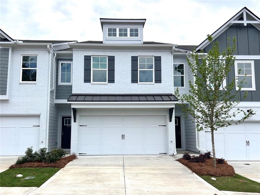 View of front of house with an attached garage, co
