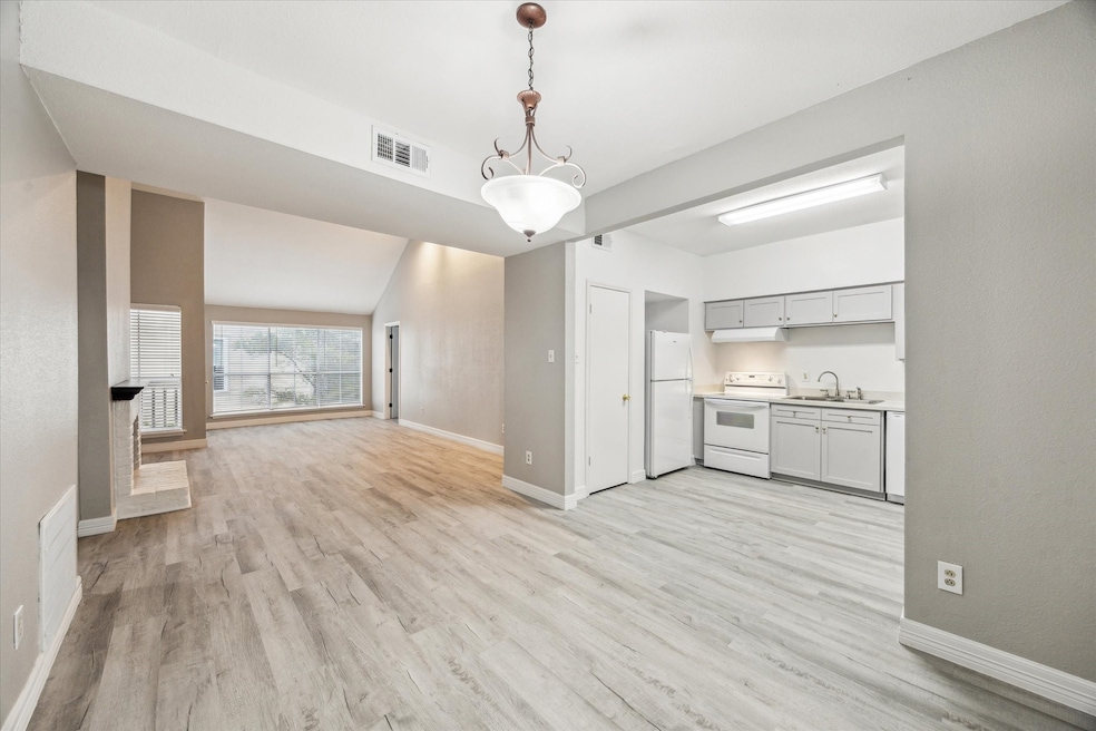 Views from the Dining Area to Kitchen and Living S