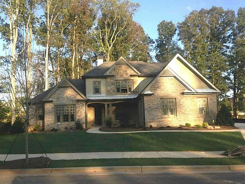 Exterior Front. Rich 4 sides Brick with stone and 