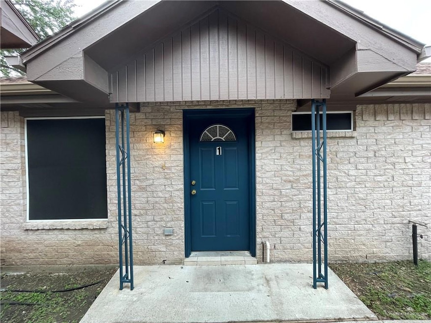 French provincial home with a front yard