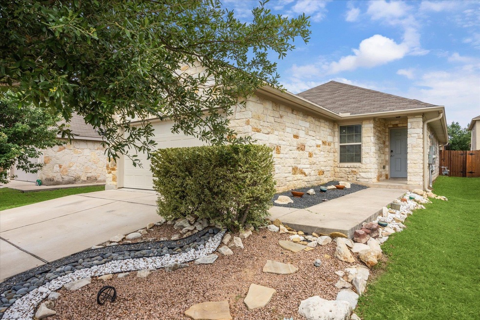View of front of house featuring stone siding, dr