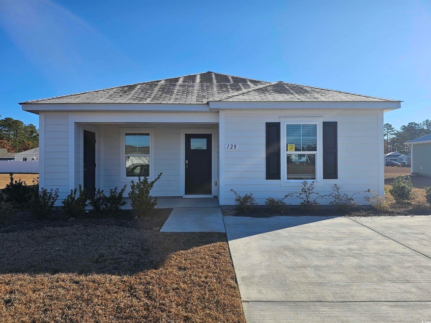View of front of house featuring a shingled roof