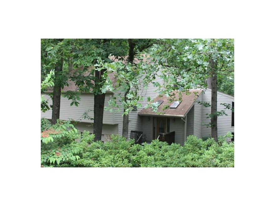 Exterior Front. Nestled in, cement siding, low mai