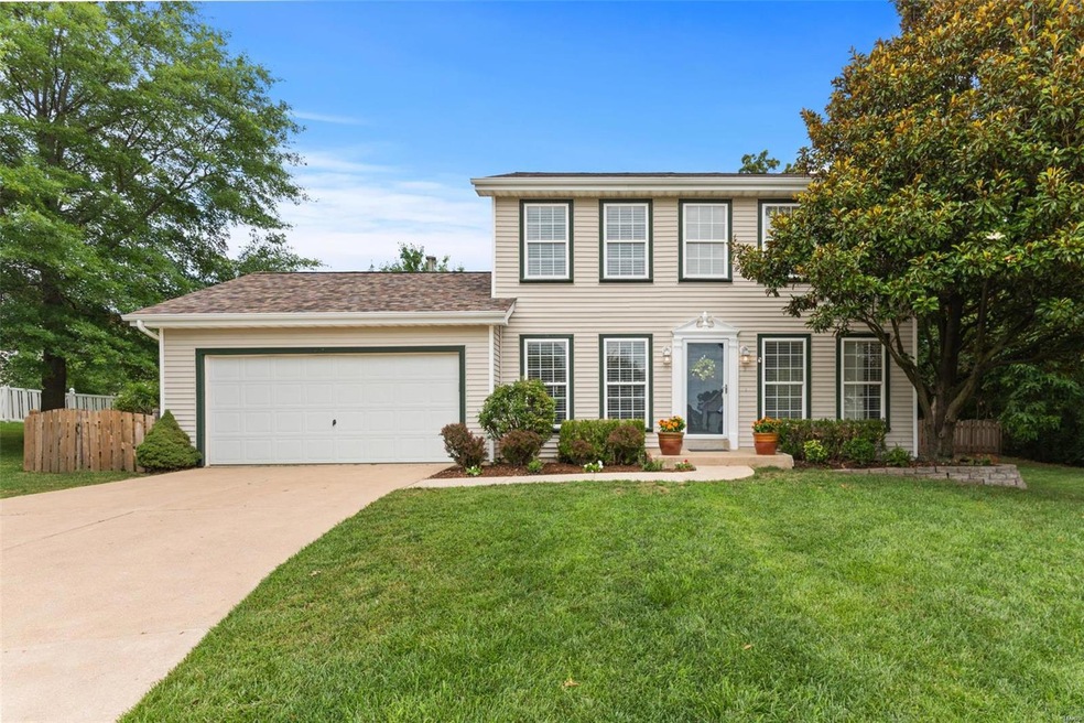 Lovely two-story with vinyl siding and updated roo