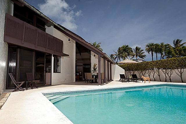 Large In-ground pool with covered patio