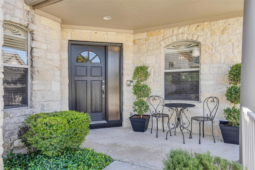 Doorway to property featuring stone siding