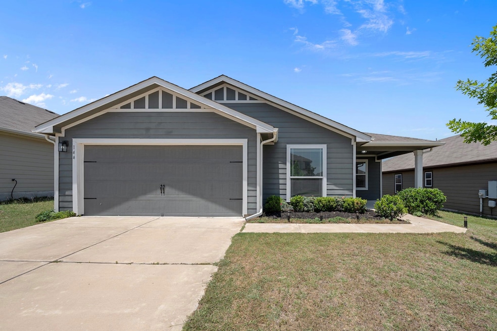 Single story home with a garage, concrete drivewa