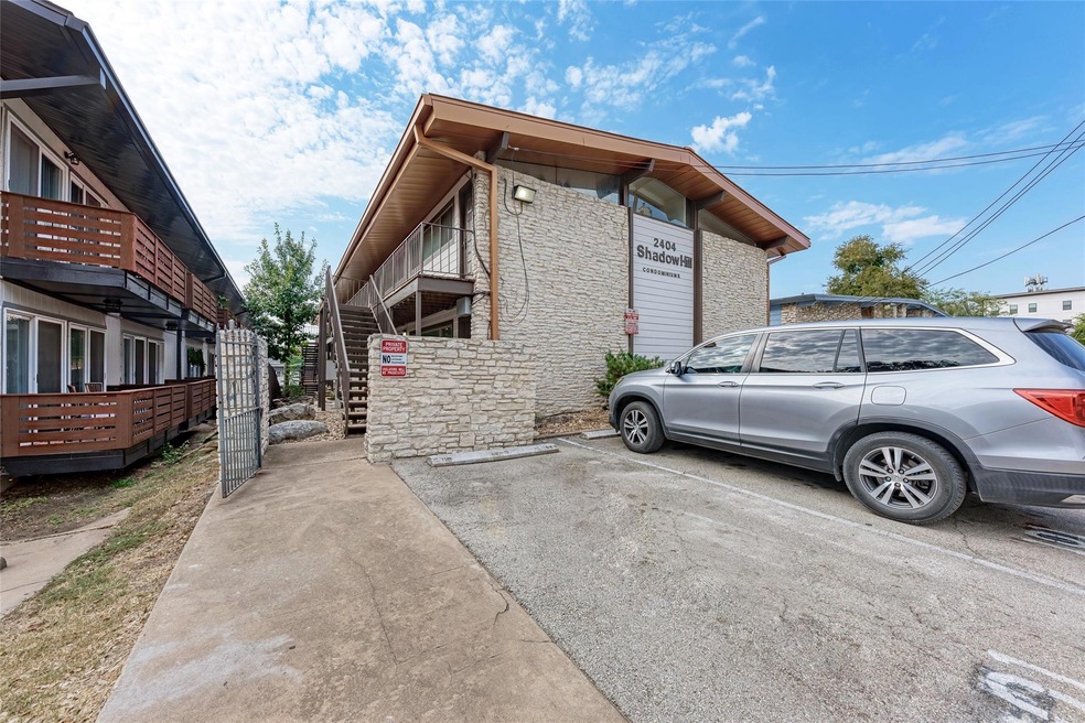 View of home's exterior featuring uncovered parki