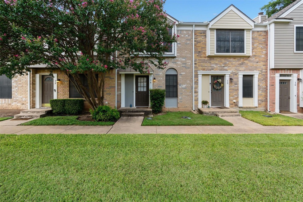 View of front of house with a front lawn and bric