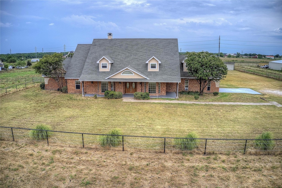 Cape cod home featuring a front lawn fenced