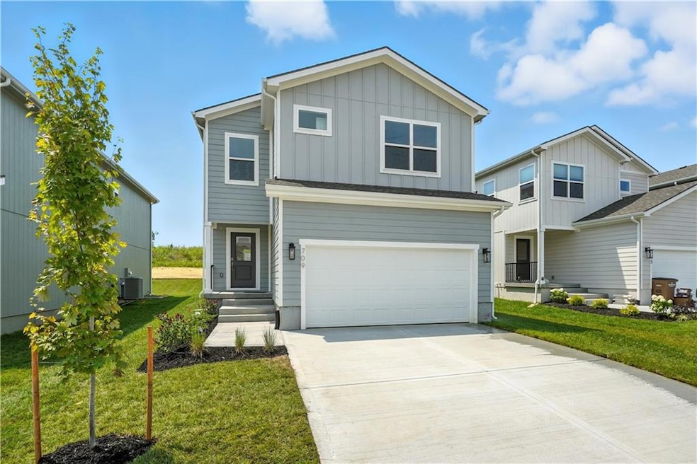 709 SW Glenn Cir, Raymore, MO 64083 - photo 1