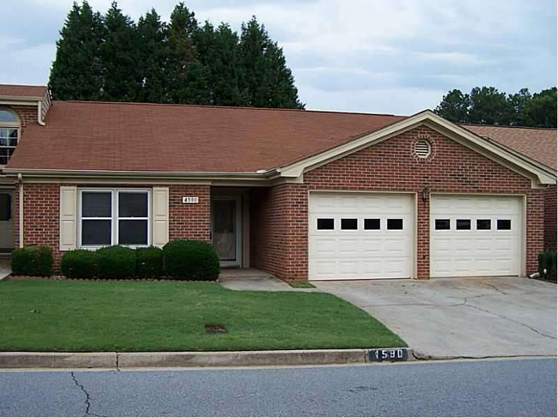 Exterior Front. Four-Sides Brick with 2-Car Garage