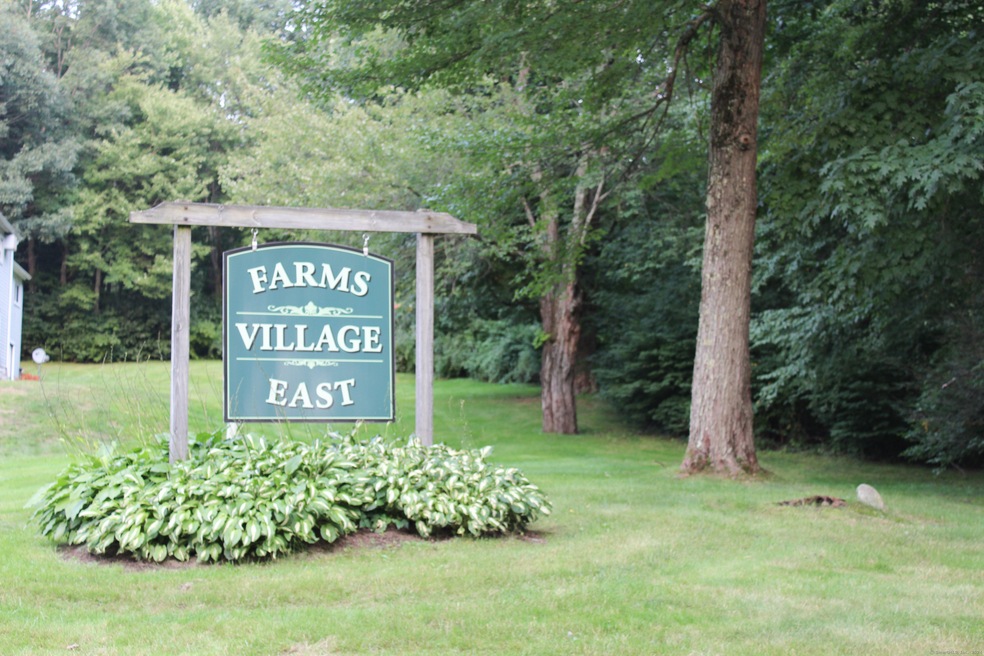 view of entry sign into condo complex