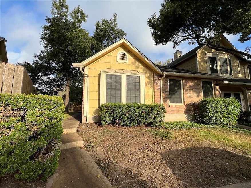 View of front of home with fence and a chimney