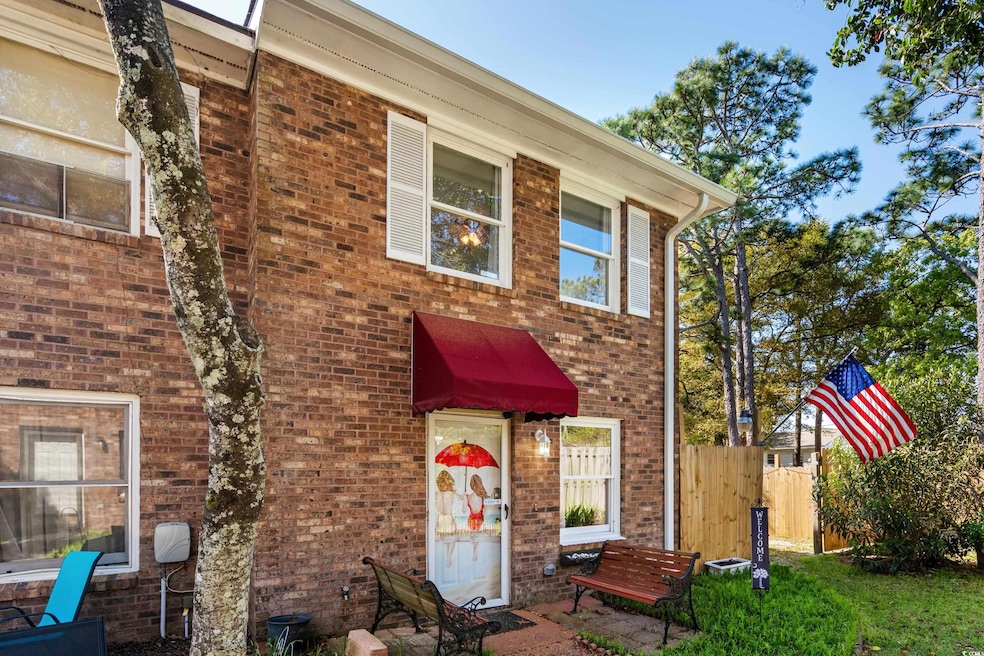 Townhome / multi-family property with brick siding