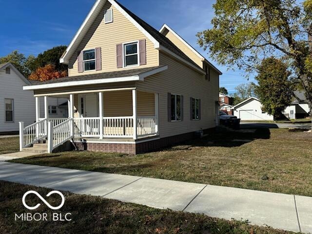 Home is on a corner lot with a large front porch.