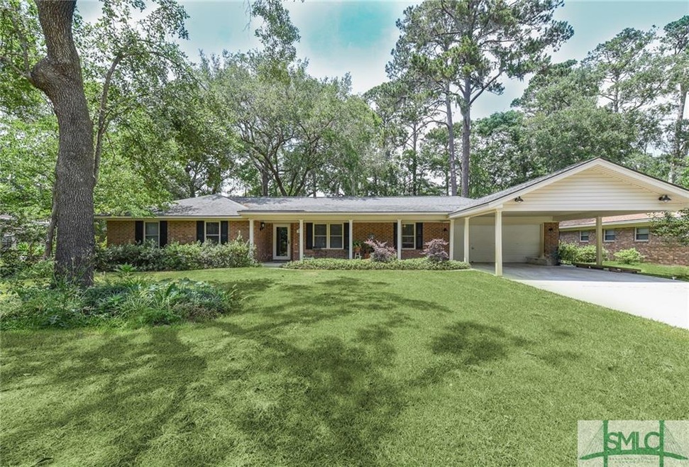 Brick home with 2 car garage and 2 car carport!