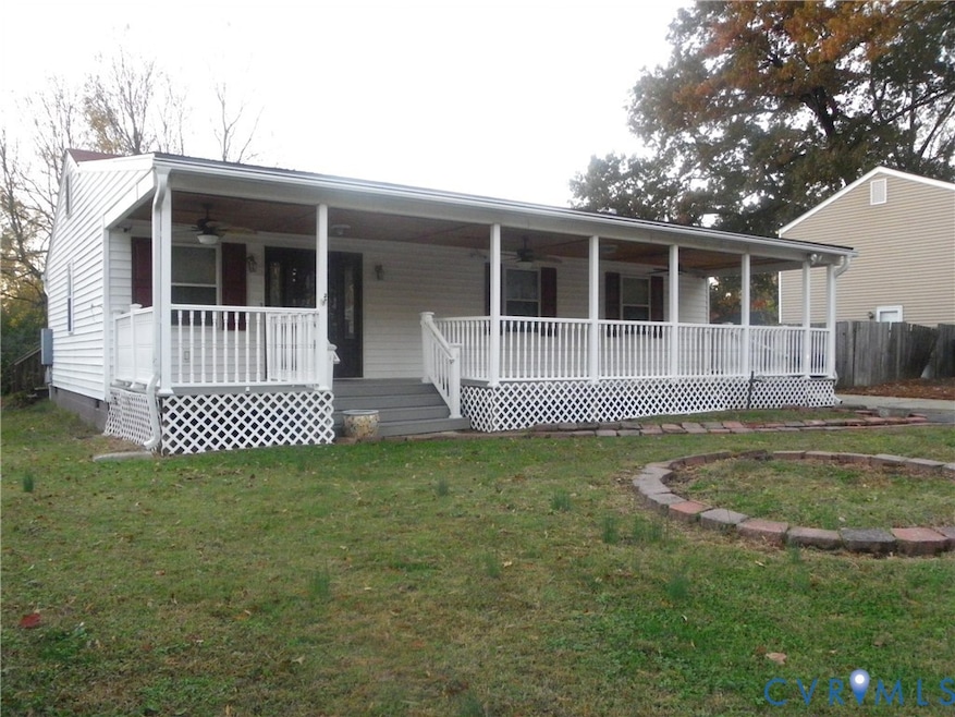View of front of house with ceiling fan, a front lawn, covered porch, and crawl space