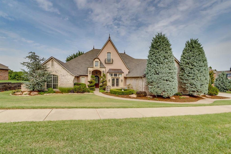 French provincial home featuring a front yard, brick siding, and a shingled roof