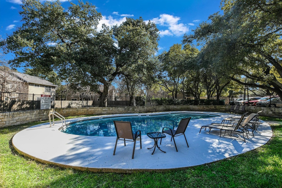Community pool with a patio area