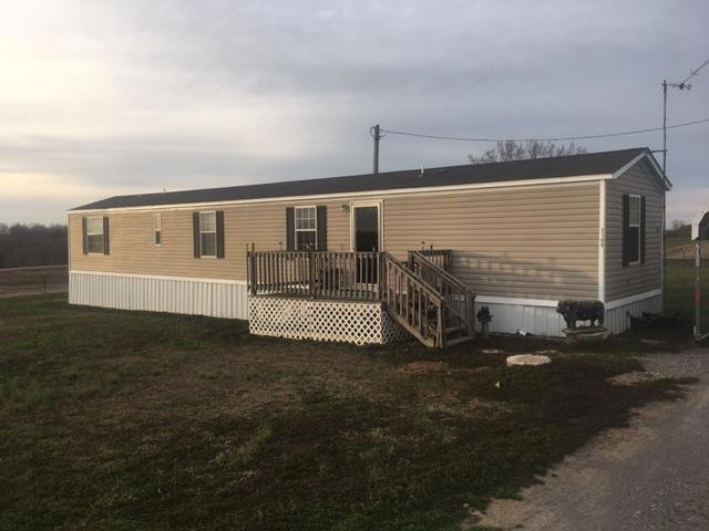 in a beautiful setting on 2.62 acres -  close to town, but private - 2 bedrooms, 2 ful baths