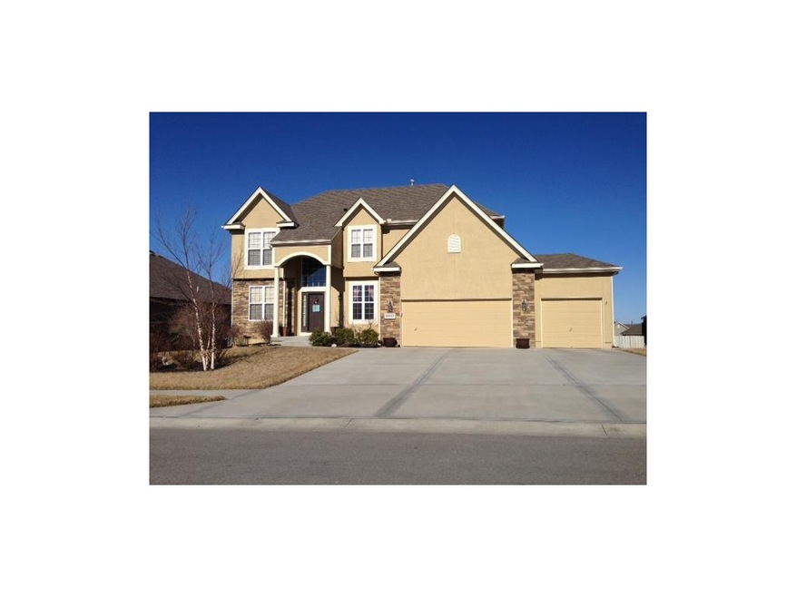 FRONT ELEVATION  WITH  STONE AND STUCCO FRONT, AND