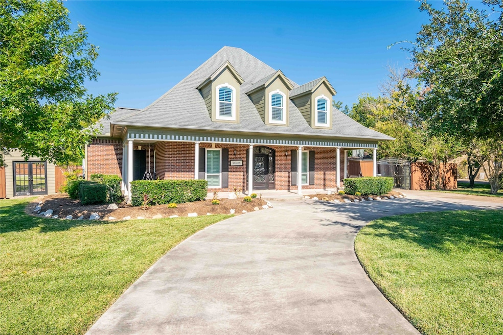 Front view with wrap around driveway.