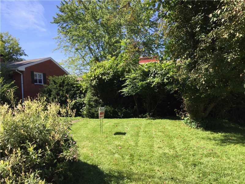 Exterior Front. Behind these shrubs is a diamond in the rough