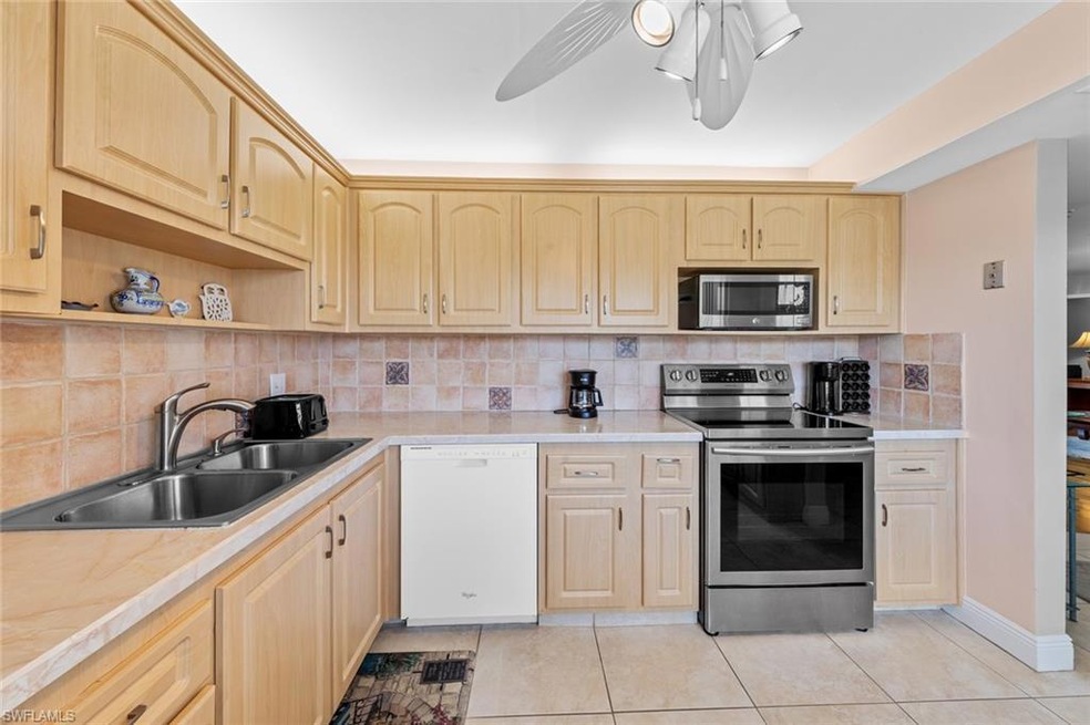 Kitchen with stainless steel appliances, light til