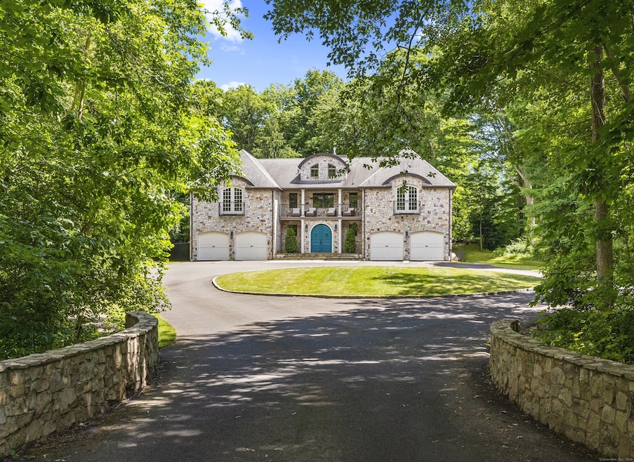 Elegant European Style home in downtown Madison. Private interior lot on just under an acre of land