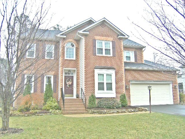 BRICK FRONT AND VINYL SIDING.
