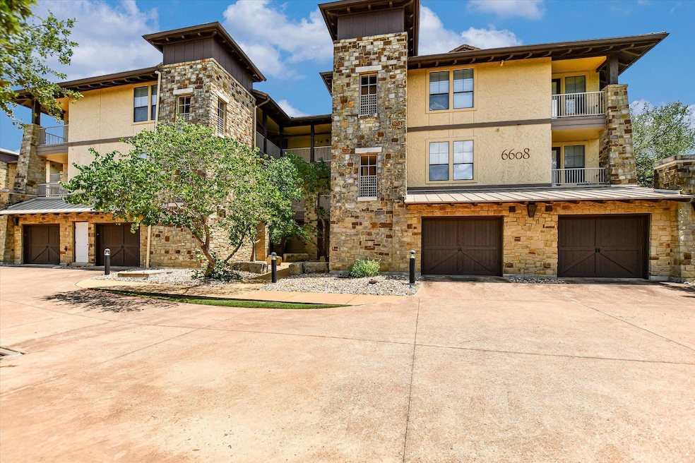 View of front facade featuring driveway, stucco s
