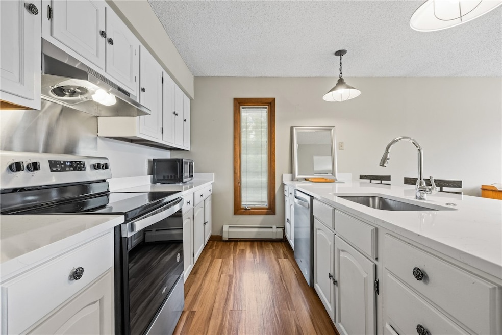Kitchen featuring stainless steel appliances, unde