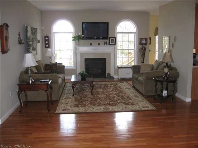 Living Room. GLEAMING HARDWOOD FLOORS GREETING YOU