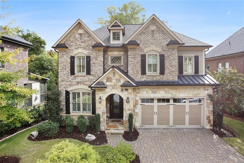 Welcome Home to this Brick & Stone Beauty!