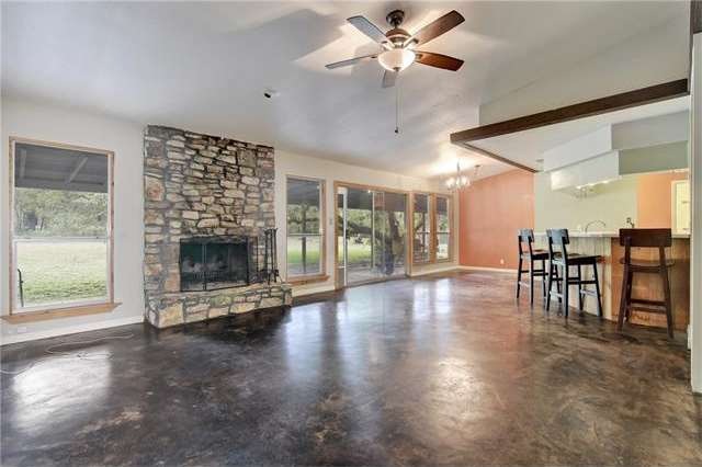 Spacious living area with scored concrete floors