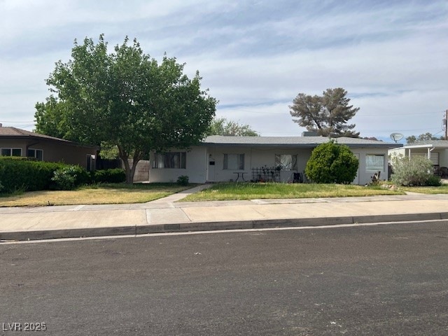 Ranch-style home with stucco siding